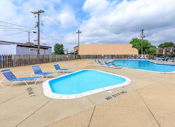 A pool with a no diving sign on the ground.