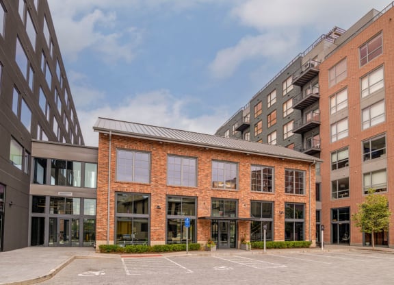 a large brick building with a courtyard in front of it at The Audubon New Haven, New Haven, CT, 06511