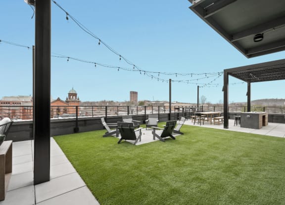 the roof terrace of a building with a lawn and chairs at The Audubon New Haven, New Haven, Connecticut
