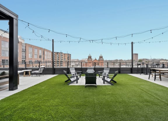 a yard with a table and chairs on top of a roof at The Audubon New Haven, New Haven, CT