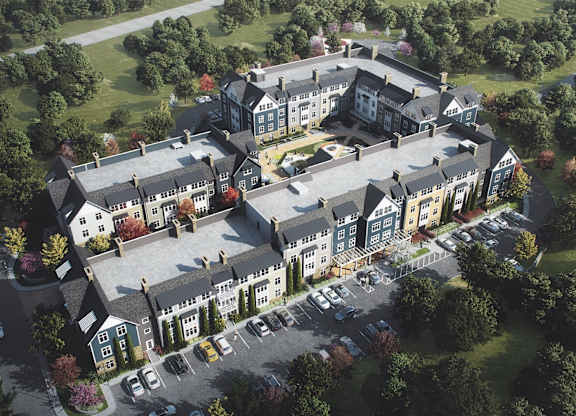 an aerial view of building with car parking at The Villages at Saugatuck, Westport, CT, 06880
