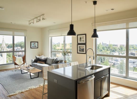 the living room and kitchen of an apartment at The Audubon New Haven, New Haven, 06511