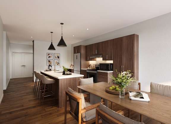 Modern kitchen with wooden floors and furniture at The Villages at Saugatuck, Westport, 06880