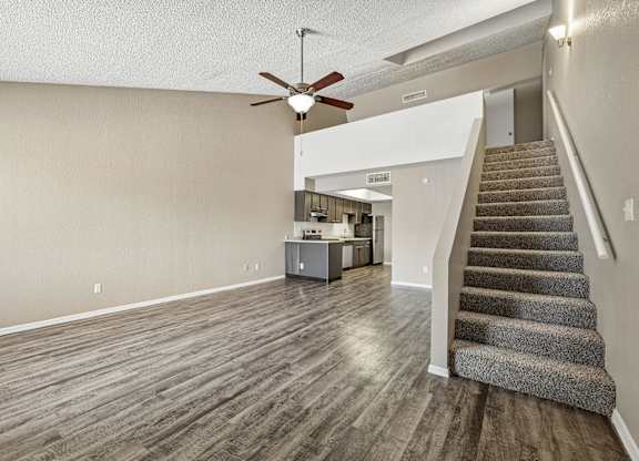 A room with a staircase leading to the upper floor.