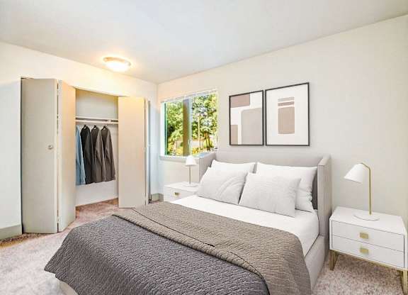 a bedroom with a bed and a closet at Autumn Village, Milton, WA