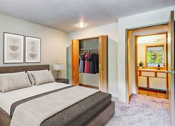 a bedroom with a bed and a closet at Autumn Village, Milton, WA