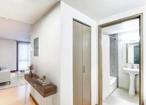 A bathroom with a white sink and a mirror.