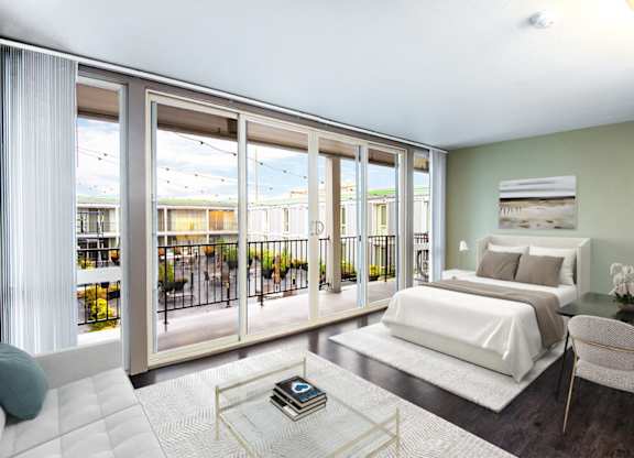 A bedroom with a large bed and a balcony with a view of the outside.