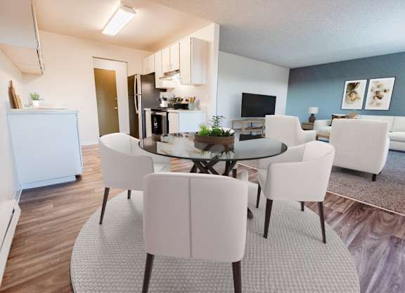 A modern dining room with a glass table surrounded by white chairs.
