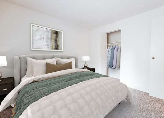 A bedroom with a large bed and a painting on the wall.