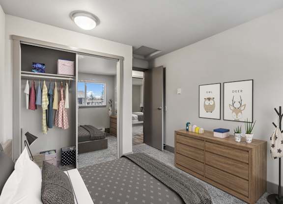 A bedroom with a bed, dresser, and a mirror.