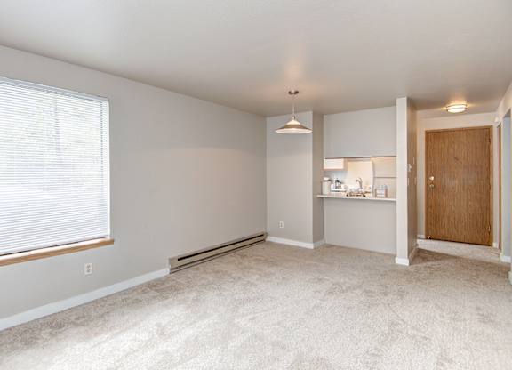 Seattle Apartments-  living area with natural light and kitchen