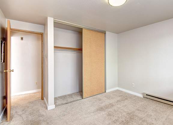 Seattle Apartments-  a bedroom with a large closet, spacious layout