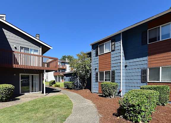 A sunny day at a residential area with two buildings and a pathway. at Brookstone, SeaTac, WA, 98198