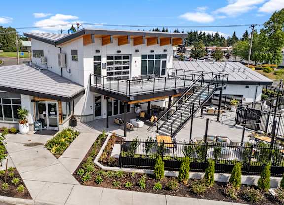 the front of a building with a balcony and a staircase at Gage On Sixth, Tacoma
