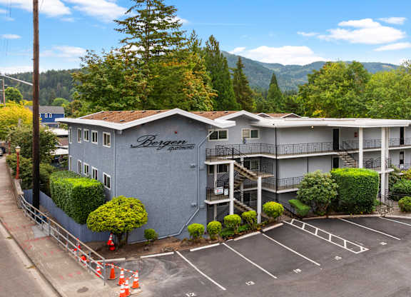 A large building with the word "Beyond" on the side is surrounded by a parking lot.