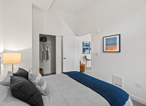 a bedroom with a large bed and a closet at Baldwyn, Seattle, WA