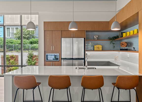 a kitchen with a large island and four chairs at Baldwyn, Seattle