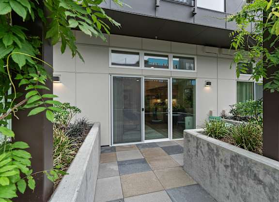 the entrance to a building with glass doors