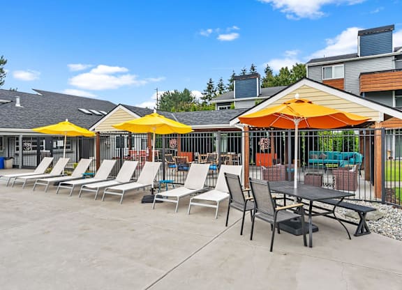 A sunny day at the outdoor seating area of a restaurant. at Northpoint Apartments, Tacoma, WA