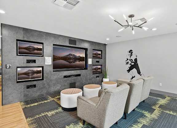 A room with a grey wall and a painting of a mountain. at Northpoint Apartments, Tacoma, Washington