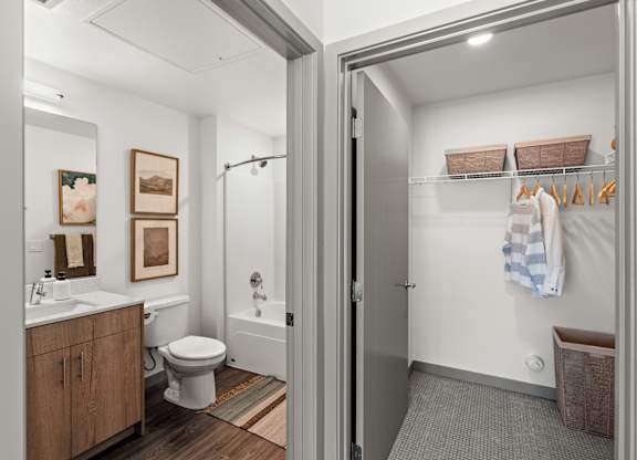 a bathroom with a shower and a toilet and a sink at Gage On Sixth, Tacoma, WA