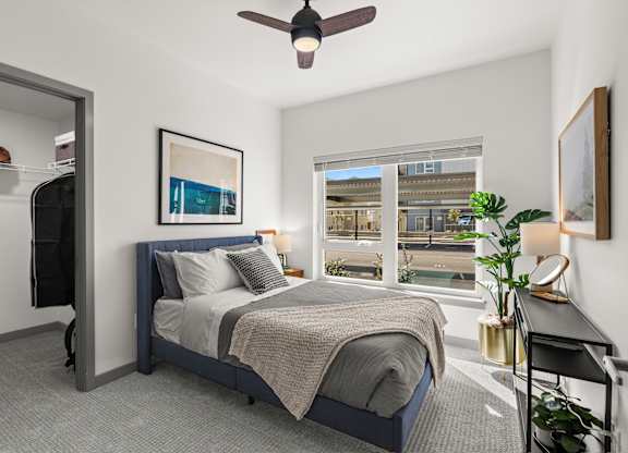 a bedroom with a bed and a ceiling fan at Gage On Sixth, Tacoma, WA 98406