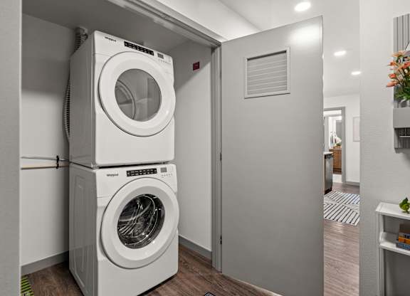 a front loading washer and dryer in a laundry room at Gage On Sixth, Tacoma, WA