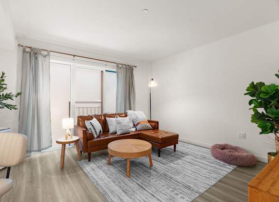 a living room with a couch and a coffee table at Baldwyn, Seattle, WA 98125
