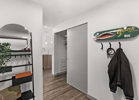 a room with a closet and a surfboard on the wall at Gage On Sixth, Tacoma