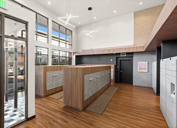 a view of the lobby of a building with wood floors and glass doors at Baldwyn, Washington