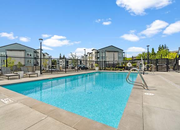 our apartments have a swimming pool with a fence around it at Gage On Sixth, Washington, 98465
