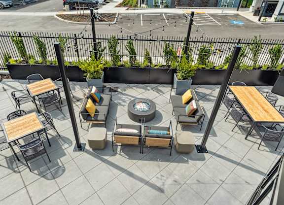 a patio with tables and chairs and a fire pit at Gage On Sixth, Tacoma, 98465