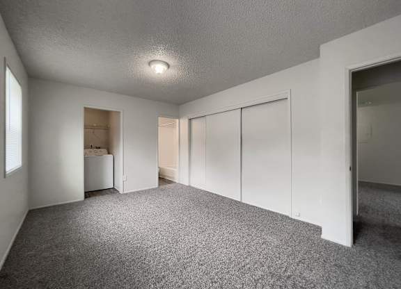 Room with attached closet and carpeted floor at Arbor Pointe, Lakewood, WA, 98498
