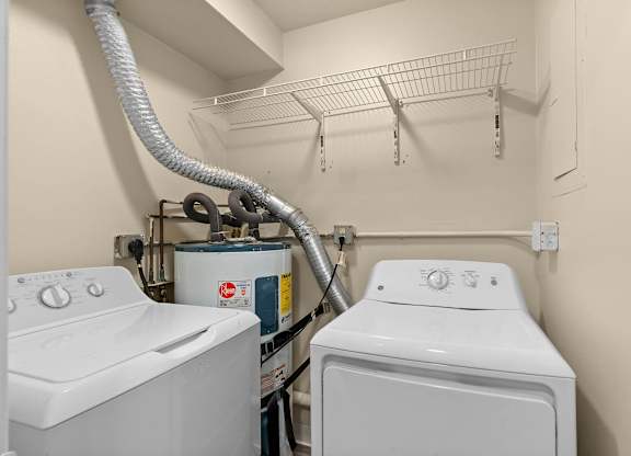 A laundry room with a washer and dryer.