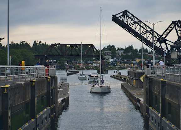 A boat is passing through a drawbridge.