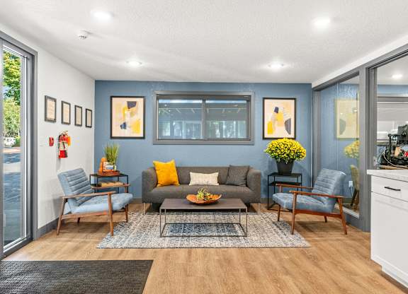 A living room with a grey couch and a coffee table.