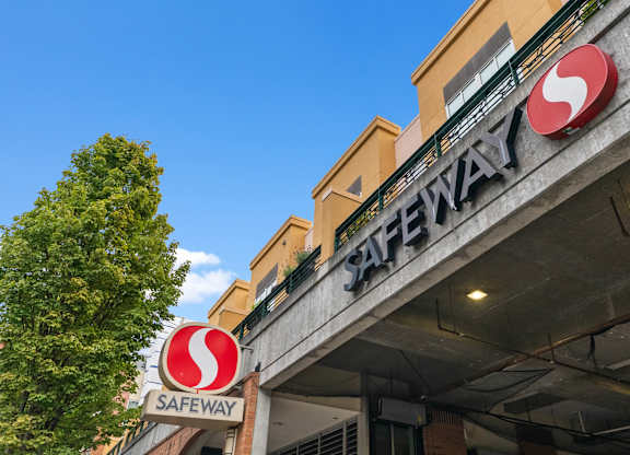 Safeway store sign on a building.