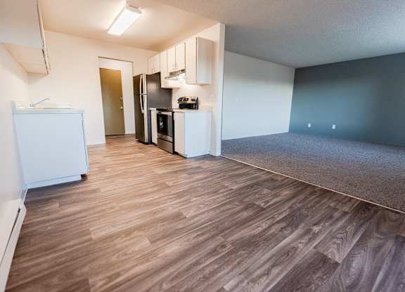 Empty room with wooden floor at Arbor Pointe, Lakewood, WA, 98498
