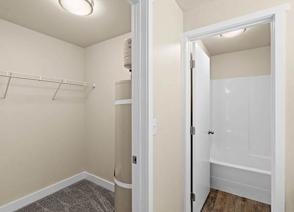 a renovated bathroom with a closet and a shower and a toilet at Bellamy Park Apartments , Lakewood, 98498