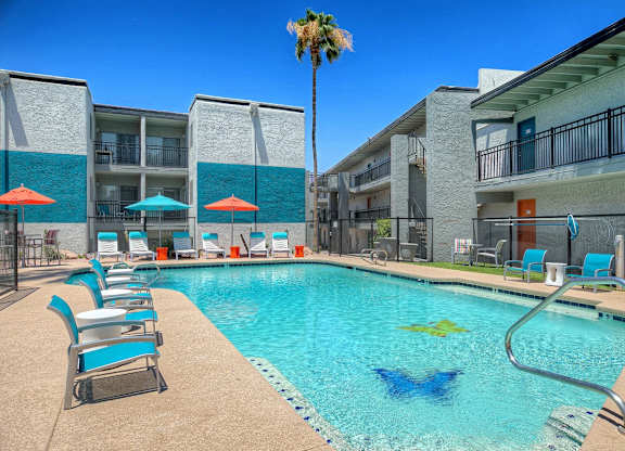 A pool with a blue fish design in the middle of it.