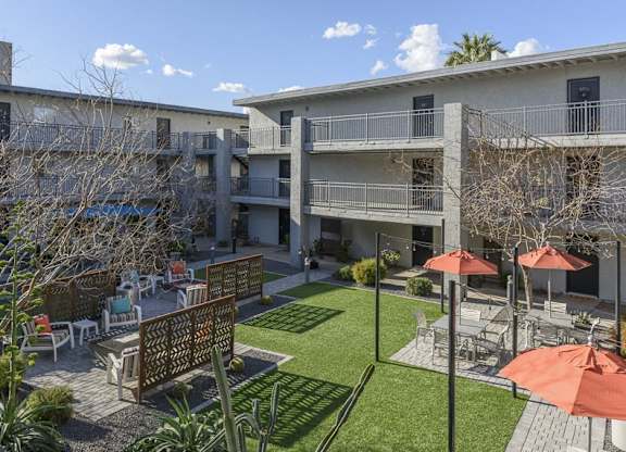 A sunny day at the apartment complex with a clear blue sky.