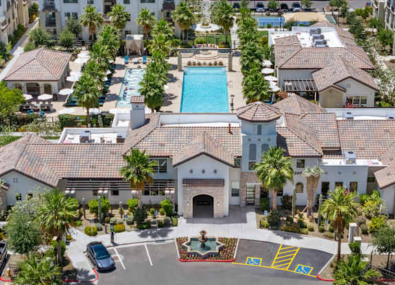 A large building with a pool in the middle of it.