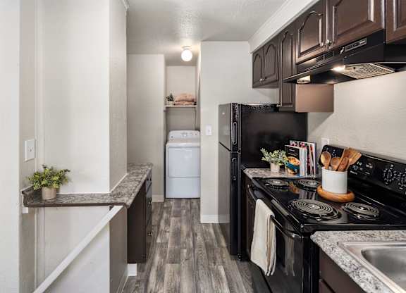 A black stove top oven with a pot on it.