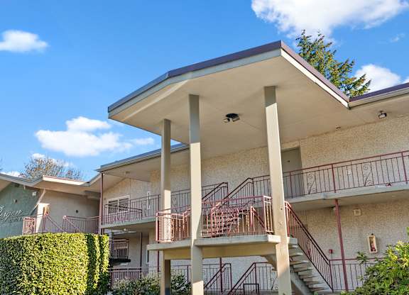 an apartment building with stairs and balconies