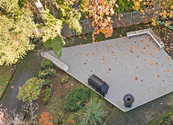 an aerial view of a roof with leaves on it