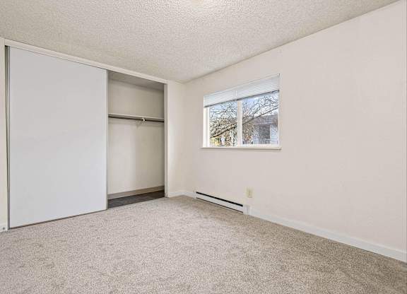 A room with a sliding door and a window. at Brookstone, SeaTac, WA, 98198