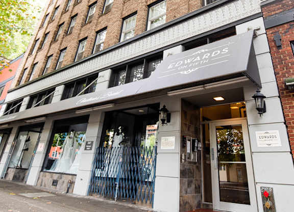 A building with a black awning and a sign that says "Edward's".