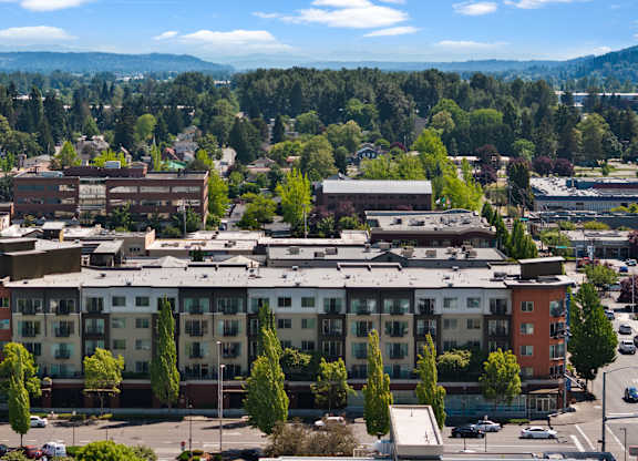 A large building with a parking lot in front of it.