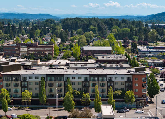 A large building with a parking lot in front of it.